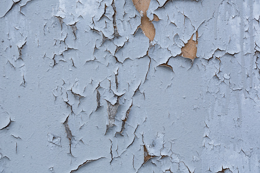 Cracked, peeling paint on the wall, texture, background