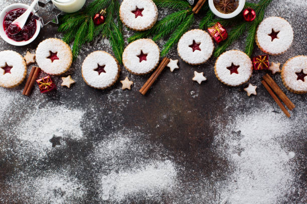 istock Traditional Christmas Linzer cookies with raspberry jam on dark background. 1282151675