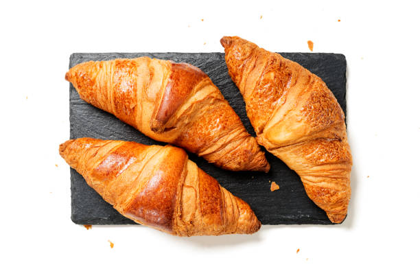 istock Three fresh croissants isolated on a white background 1282153084