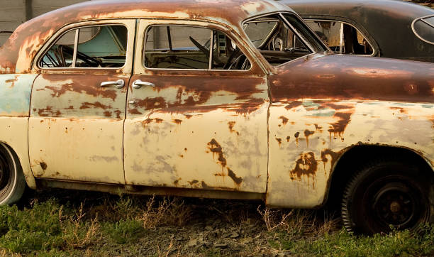 istock Former glamorous cars rusting away into scrap 1282153937
