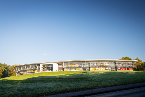 Canterbury, England - Oct 24 2020: Front view of the curved structure of the Canterbury Innovation Centre building on the grounds of the University of Kent on 24th Oct in Canterbury, Kent, England.