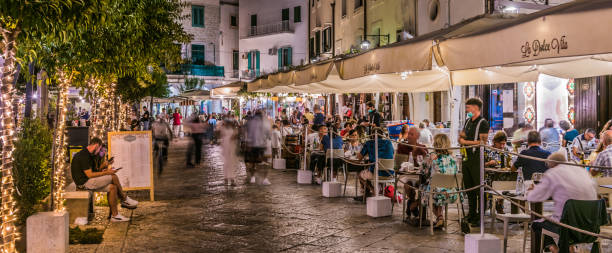 Street night view of Monopoli old town, Apulia, Italy MONOPOLI, ITALY - SEP 2, 2020: Street night view of Monopoli old town, Apulia, Italy. monopoli puglia stock pictures, royalty-free photos & images