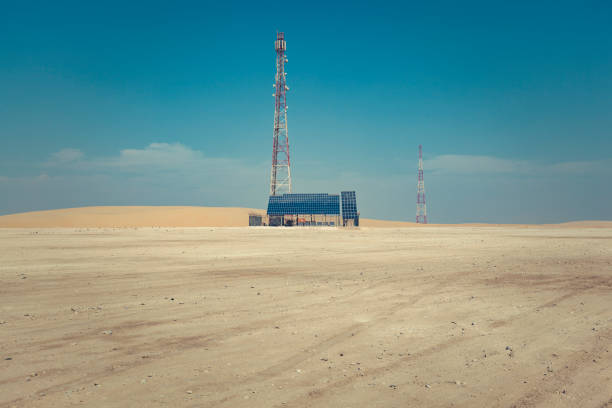 communication tower powered by solar energy in the desert of qatar, middle east.