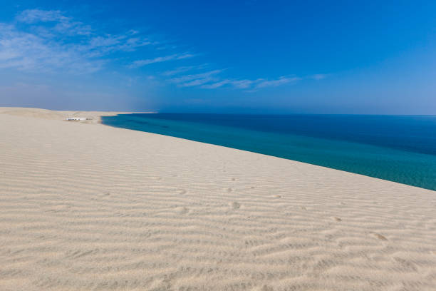 Sahara desert with Atlantic ocean meets near coast - Morocco, North Africa