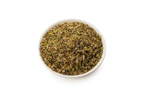 istock Oregano in a bowl isolated. 1282159156