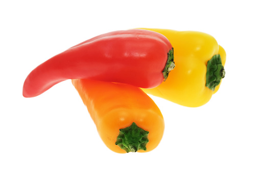 Three colourful bell peppers - white background