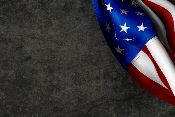 istock US flag on concrete background. Background for creating a postcard or invitation card 1282163640