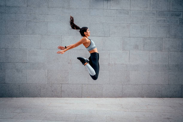 istock Woman athlete jumping during exercising 1282163723