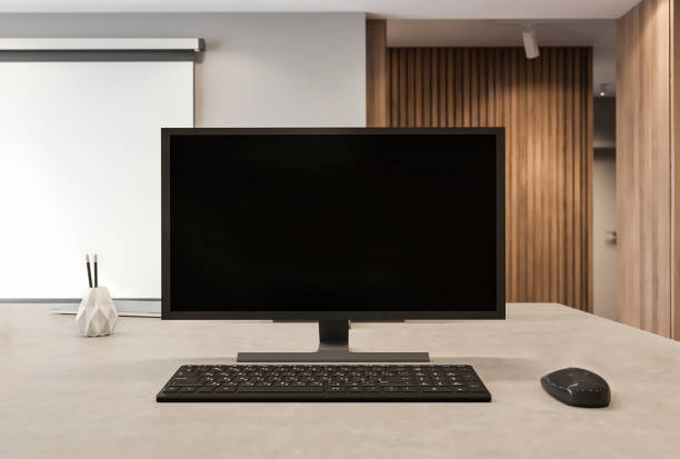 istock Blank computer monitor on office desk 1282163941