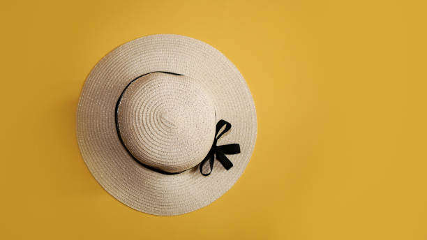 istock Summer straw hat on yellow background top view flat lay copy space. 1282166621