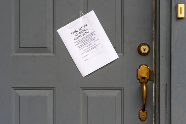Eviction Final Notice to Vacate Immediately on House Door Eviction Final Notice to Vacate Immediately on House Door eviction photos stock pictures, royalty-free photos & images