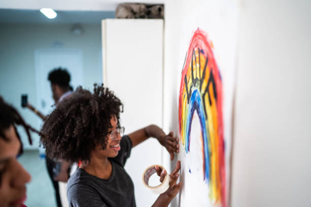 istock Students fixing in the wall a poster about LGBTQI rights 1282167796