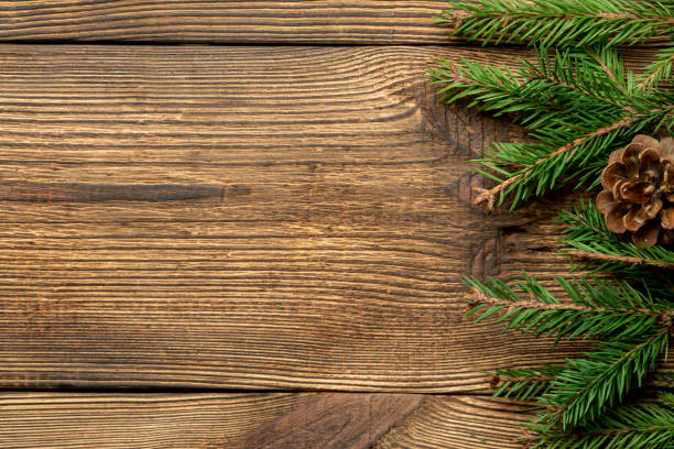 istock Fir, spruce branches on brown wooden background with copy space 1282168474