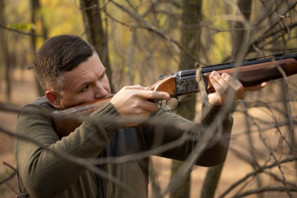 istock Close up image of male shooting rifle. 1282169882