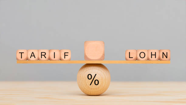 Balance between tariff and wages stock photo