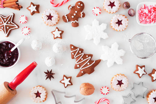 istock Christmas baking table scene with cookies and sweets. Top down view over white marble. 1282170266