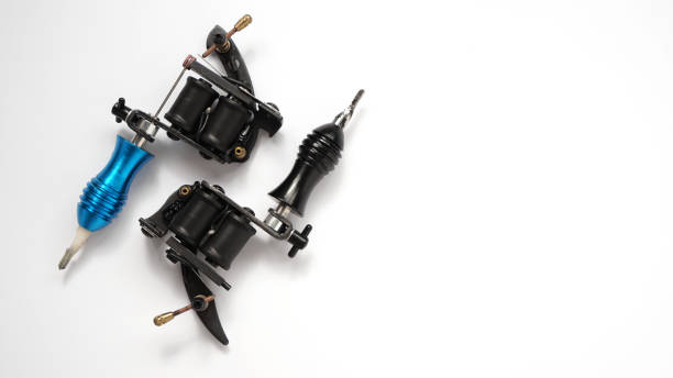 istock Two tattoo machines on a white background - space for text 1282170378