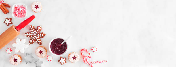 istock Christmas baking corner border with cookies and sweets. Top view over a white marble background. 1282170394
