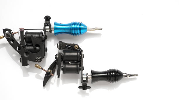 istock Two tattoo machines on a white background - space for text 1282170482