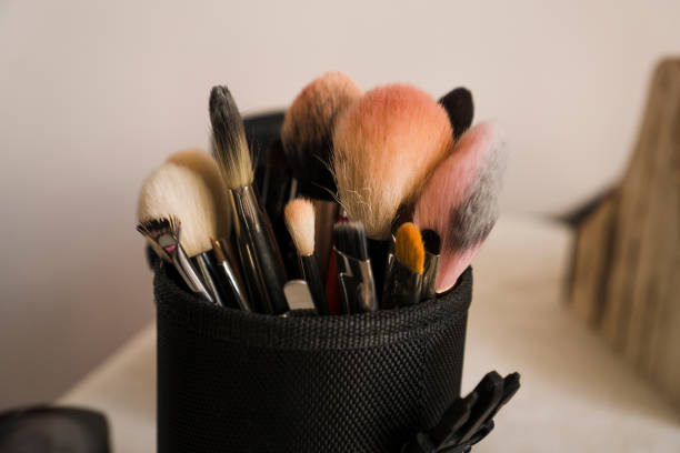 istock Makeup brushes in a makeup artist case on blurred background 1282176832
