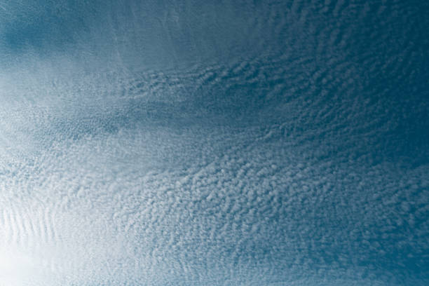 Background from a lot of white small clouds on blue sky
