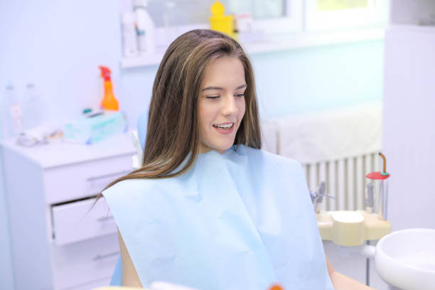 istock Dentist working with patient at light medical background 1282177923