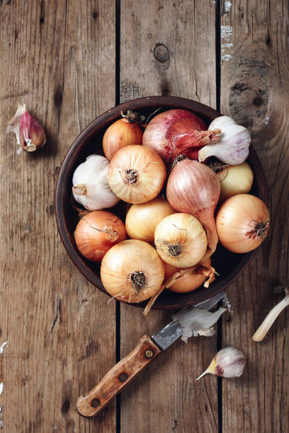istock Yellow, red onions and garlic. 1282178658