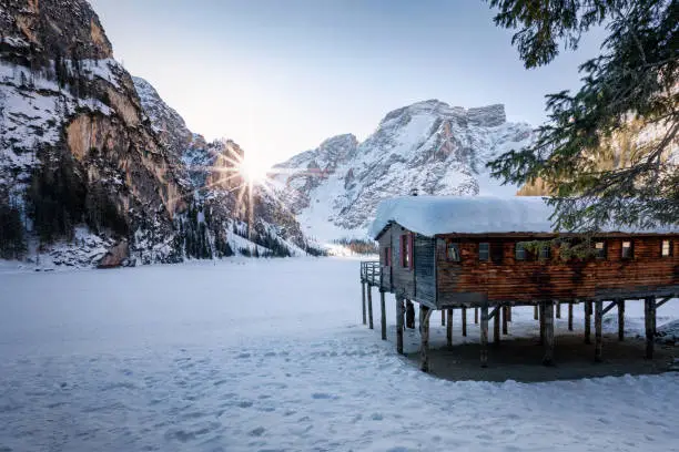 Photo of Sunrise behind the Dolomites Mountains at Lago di Braies