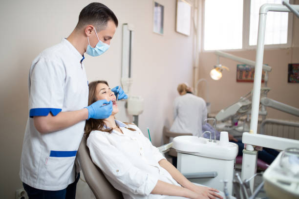 istock Dentist examining patient's teeth in the dentist office 1282182742