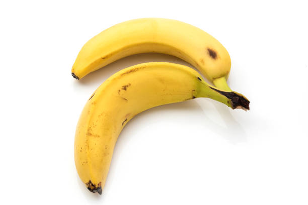 istock Two old banana with some spots, on a white isolated background. 1282183365