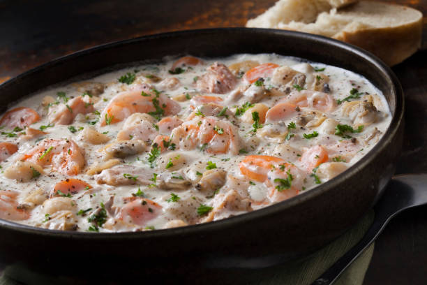 istock Seafood Chowder with Shrimp, Bay Scallops, Clams and Salmon 1282187100