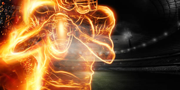 silhouette eines american-football-spielers in flammen auf dem hintergrund des stadions. konzept für sport, geschwindigkeit, wetten, amerikanisches spiel. - sport university football player action stock-fotos und bilder