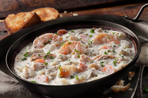 istock Seafood Chowder with Shrimp, Bay Scallops, Clams and Salmon 1282189878