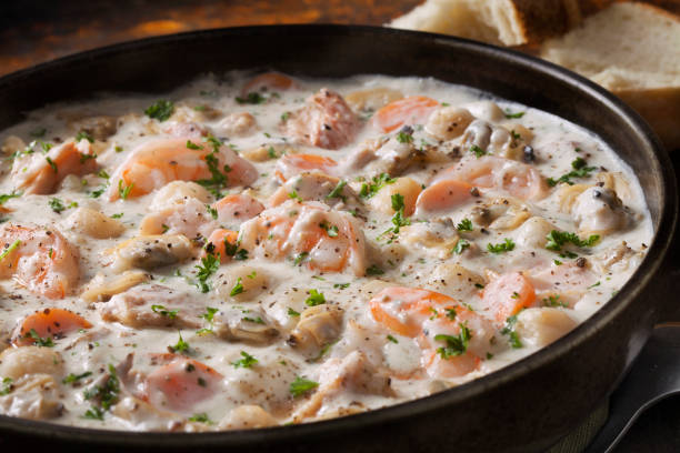istock Seafood Chowder with Shrimp, Bay Scallops, Clams and Salmon 1282189954