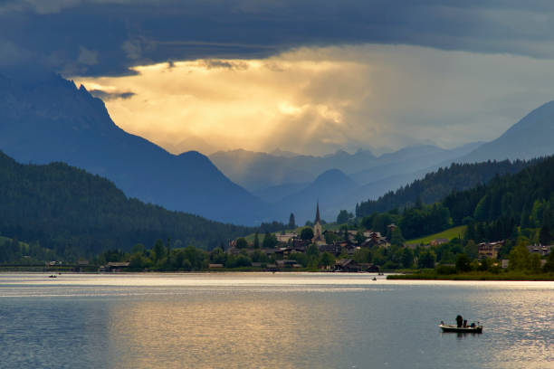 istock Dramatic sky and sunset lake Weissensee Austria 1282190781