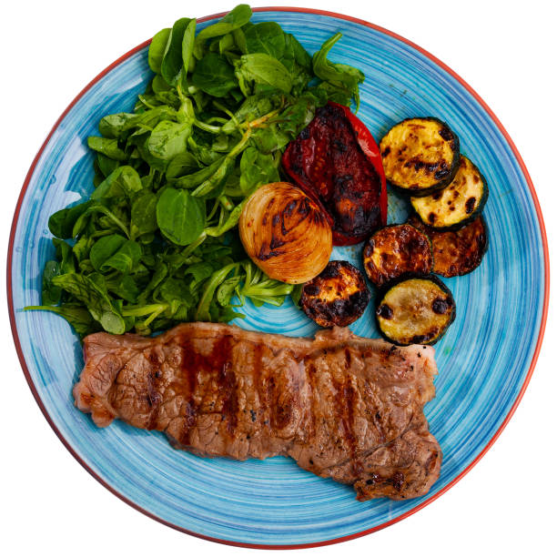 istock Grilled veal chop with vegetables and greens 1282191799