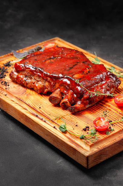 istock Ribs in sauce on a wooden board 1282192041