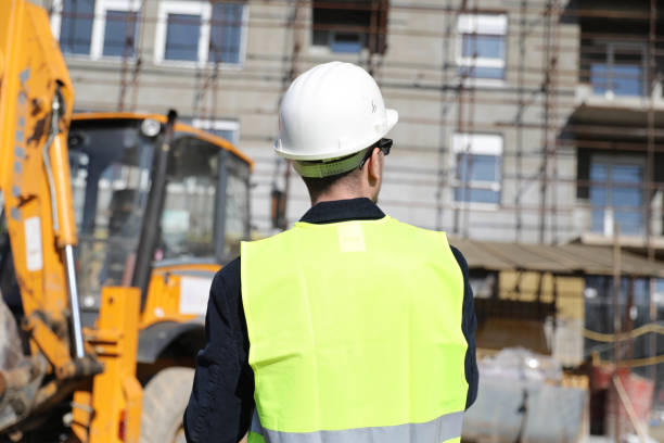 istock Back view of the engineer in worker helmet 1282193099