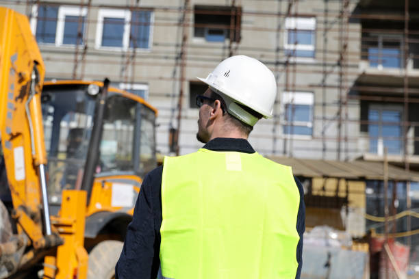 istock Back view of the engineer in worker helmet 1282193126