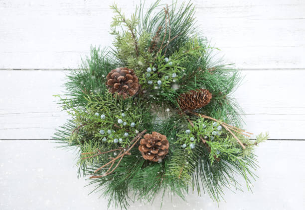 istock Christmas wreath on an old white wood background 1282195714