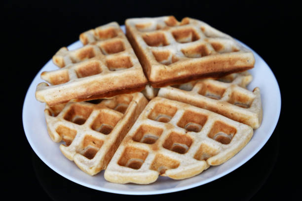 istock Belgian waffles in white plate on black glass table 1282198123