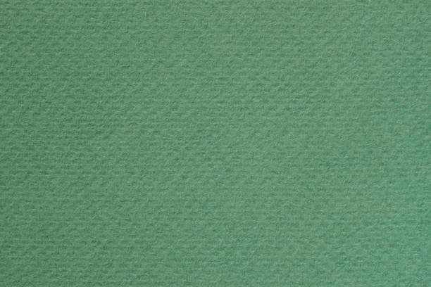 istock Texture of green artistic paper for artwork. Modern background, copy space 1282199099