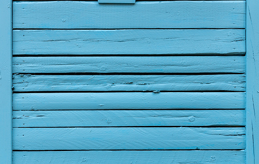 High resolution cracked wood planks, painted with thick blue color.