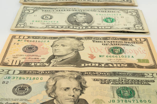 istock close-up of different values of US dollars arranged on a white surface 1282200111
