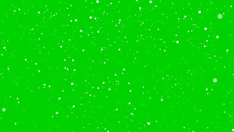 Isolated falling snow on green chroma key background