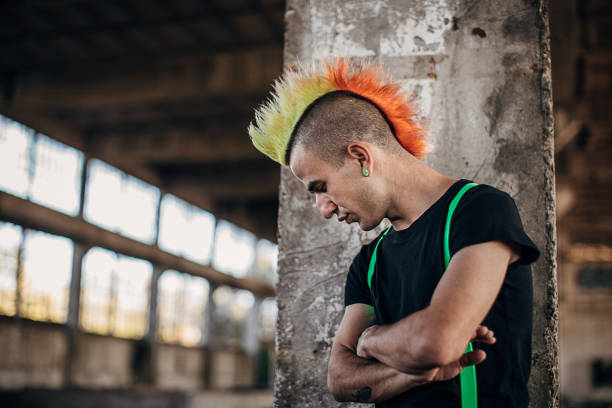 istock Male punk person standing alone in abandoned building 1282202626