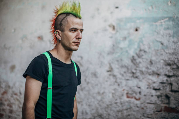 istock Male punk person standing in abandoned building 1282202677