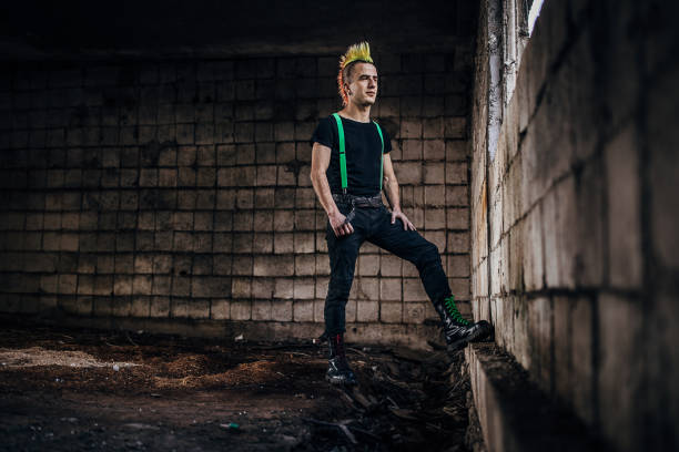 istock One young panker standing in abandoned warehouse with crossed arms 1282202704