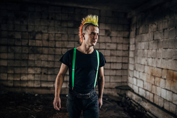 istock One pank man with colorful coiffure walking in abandoned warehouse 1282202732