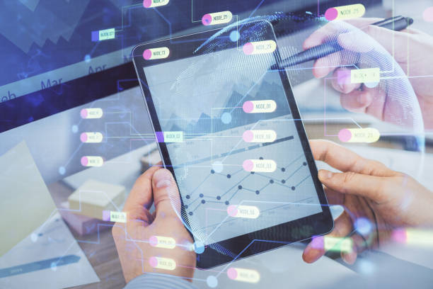istock Multi exposure of man's hands holding and using a digital device and data theme drawing. Innovation concept. 1282202781